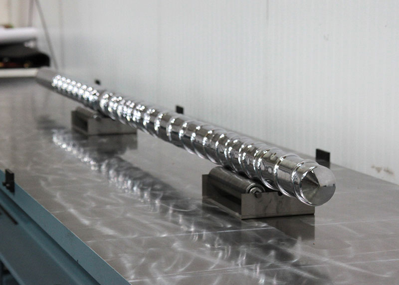 Max Impact™ screw with evolution mixer tip on process consultant’s inspection station.
